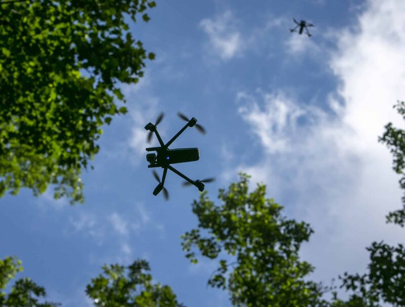 Unmanned aerial systems flying above trees